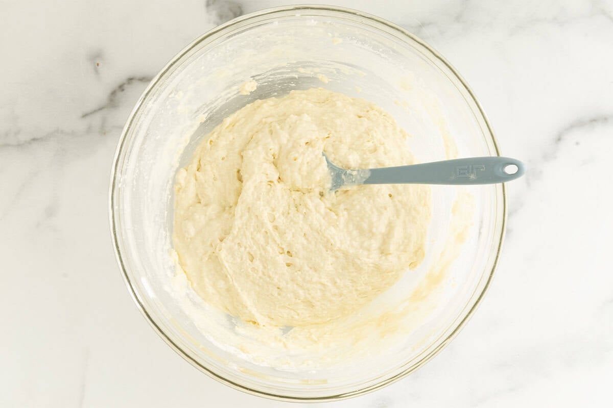 Batter for cottage cheese waffles in glass bowl.