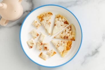baby pizza on white plate.