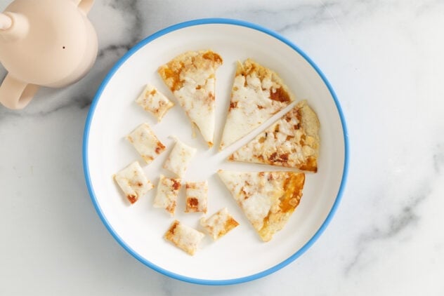 baby pizza on white plate.