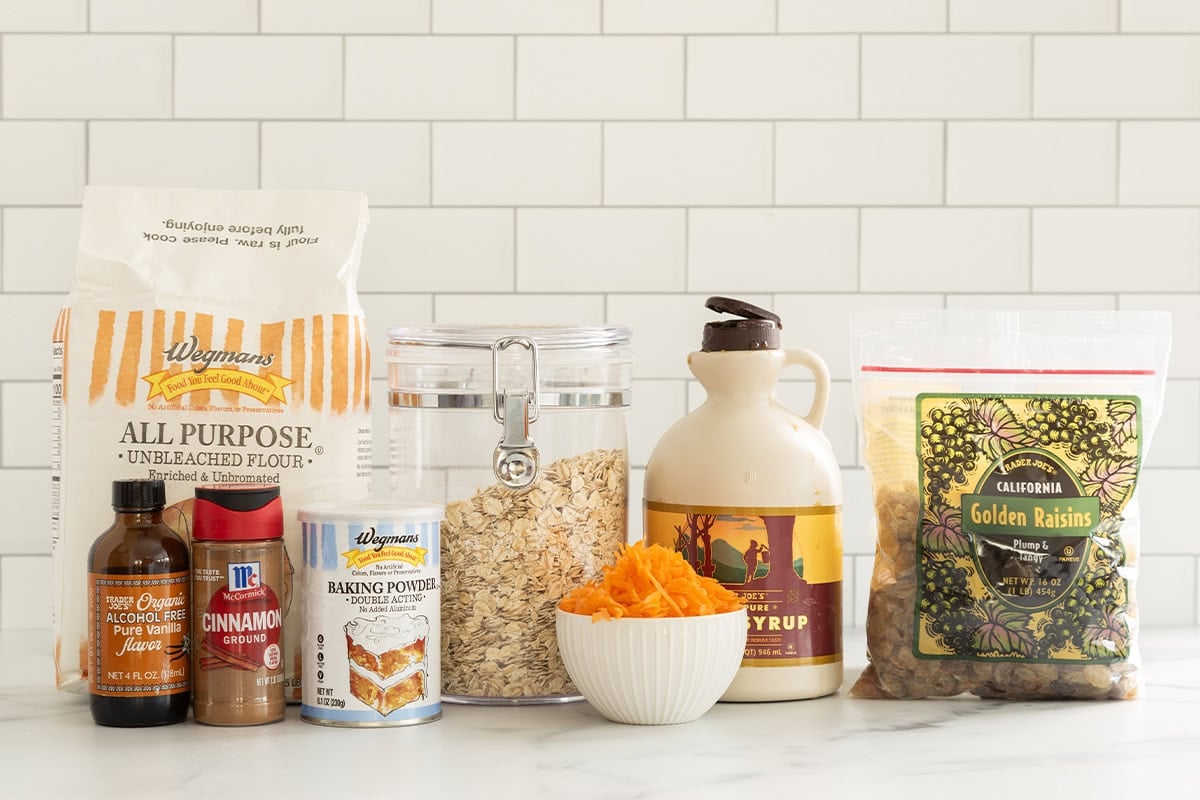 Ingredients for carrot oatmeal cookies on countertop.