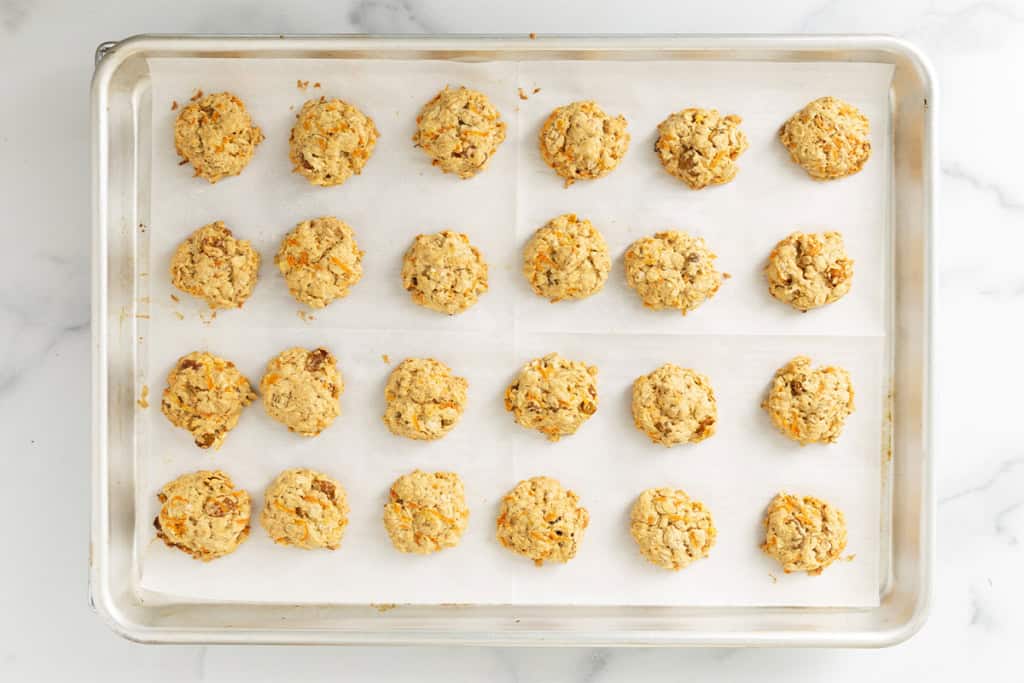 Carrot oatmeal cookies on baking sheet.