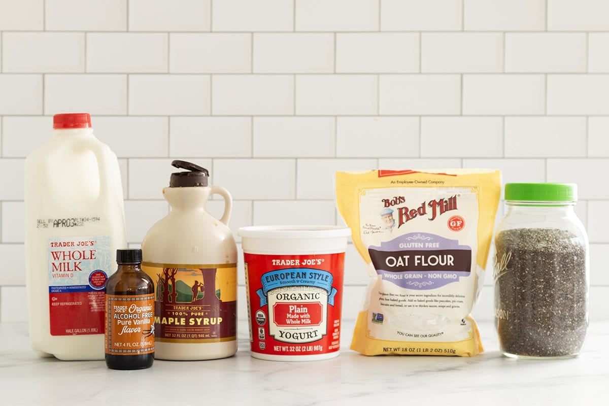 Ingredients for Chia pudding overnight oats on countertop. 