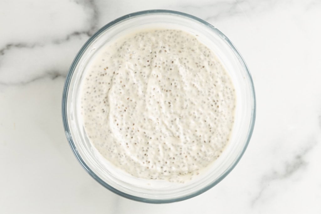 Chia pudding overnight oats in glass bowl.