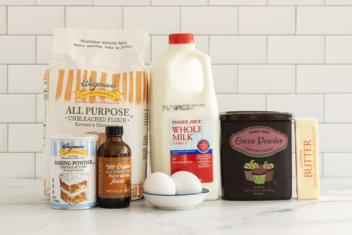 Ingredients for chocolate waffles on countertop.