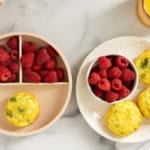Cottage cheese egg bites on plate with raspberries.