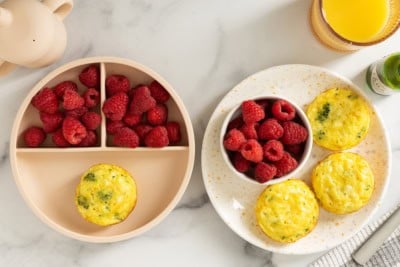 Cottage cheese egg bites on plate with raspberries.
