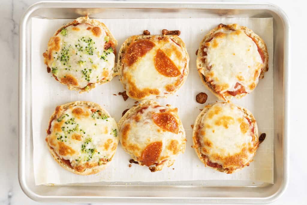 mini pizzas on baking pan.