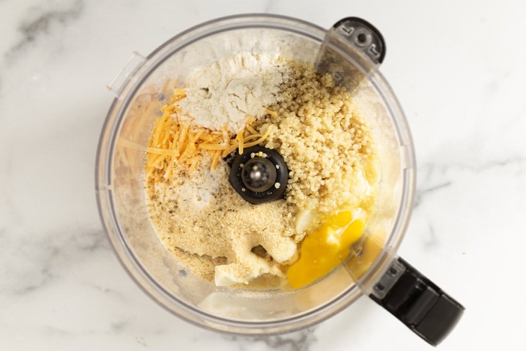 Ingredients for quinoa bites in food processor.