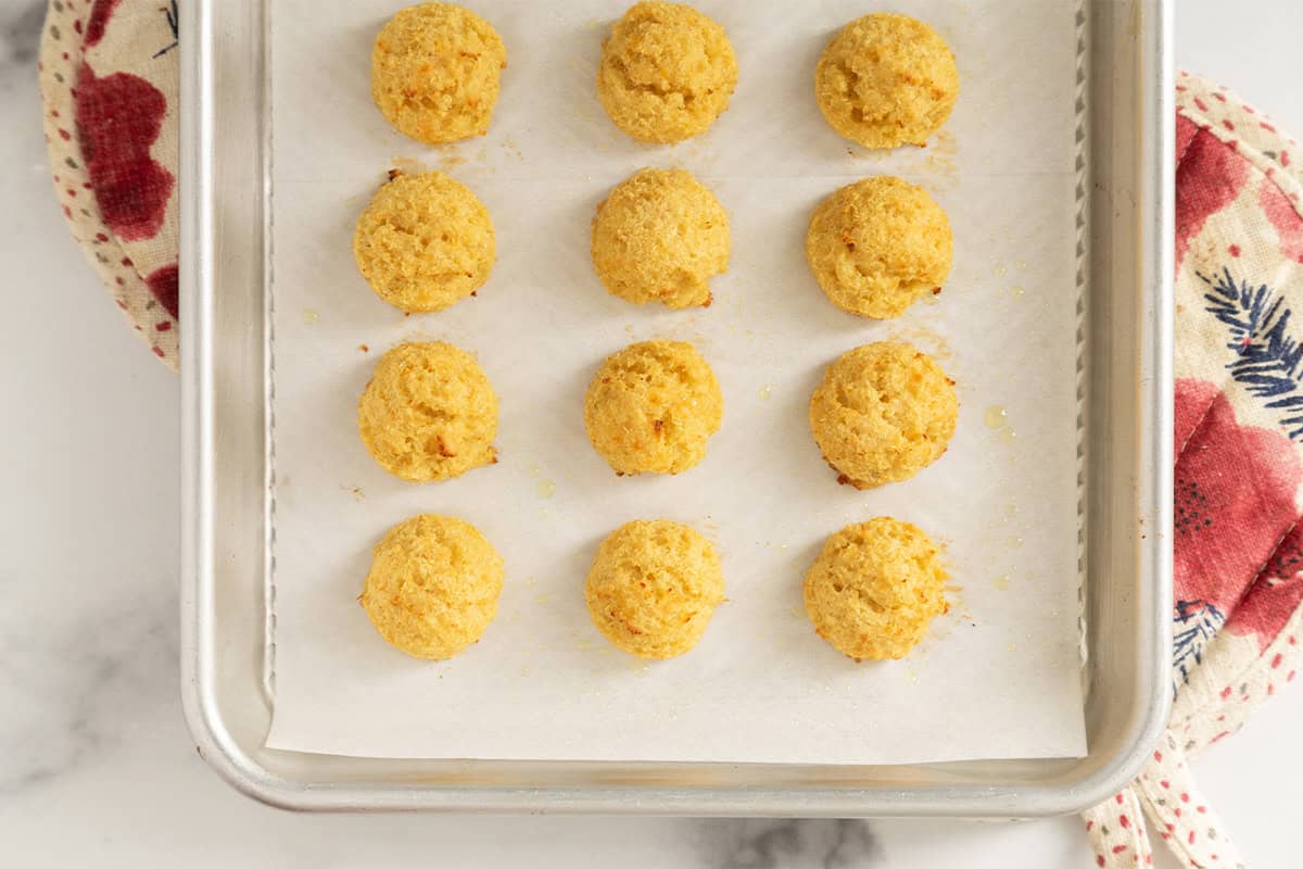 Quinoa bites on baking sheet after baking.