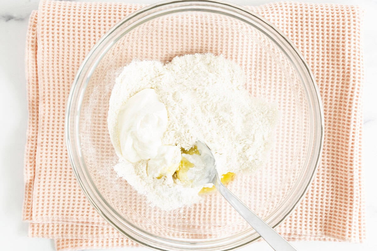 ingredients for baby pizza crust in glass bowl.