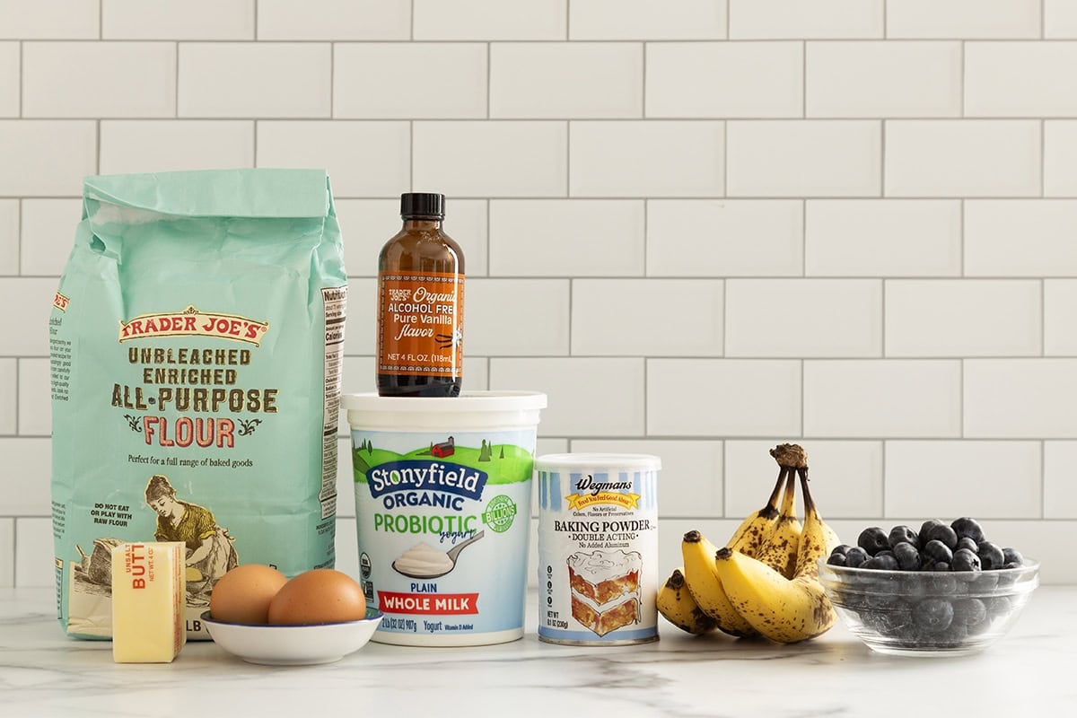 Ingredients for blueberry banana pancakes on countertop.