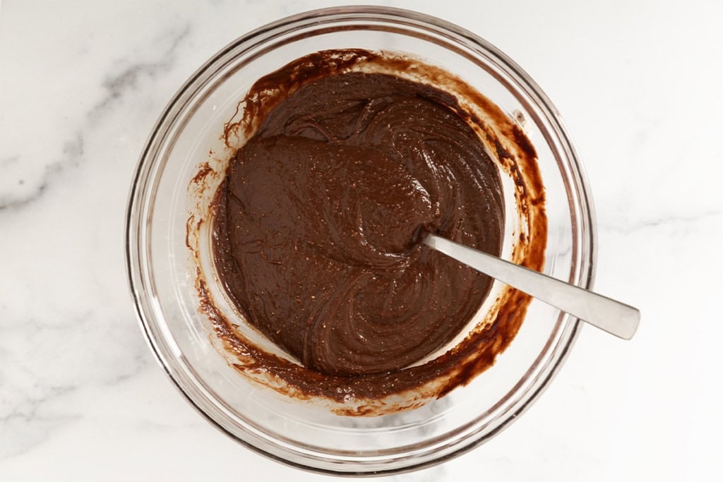 Chocolate mixture in glass bowl for chocolate crunch bars.