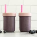 Hi fiber smoothie in two cups with lids and straws.