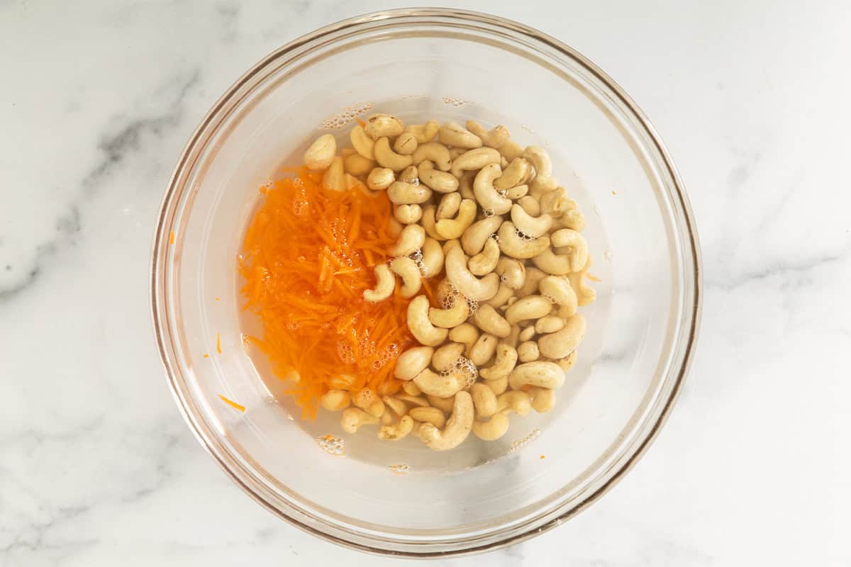 Cashews and carrots soaking in water for carrot balls.