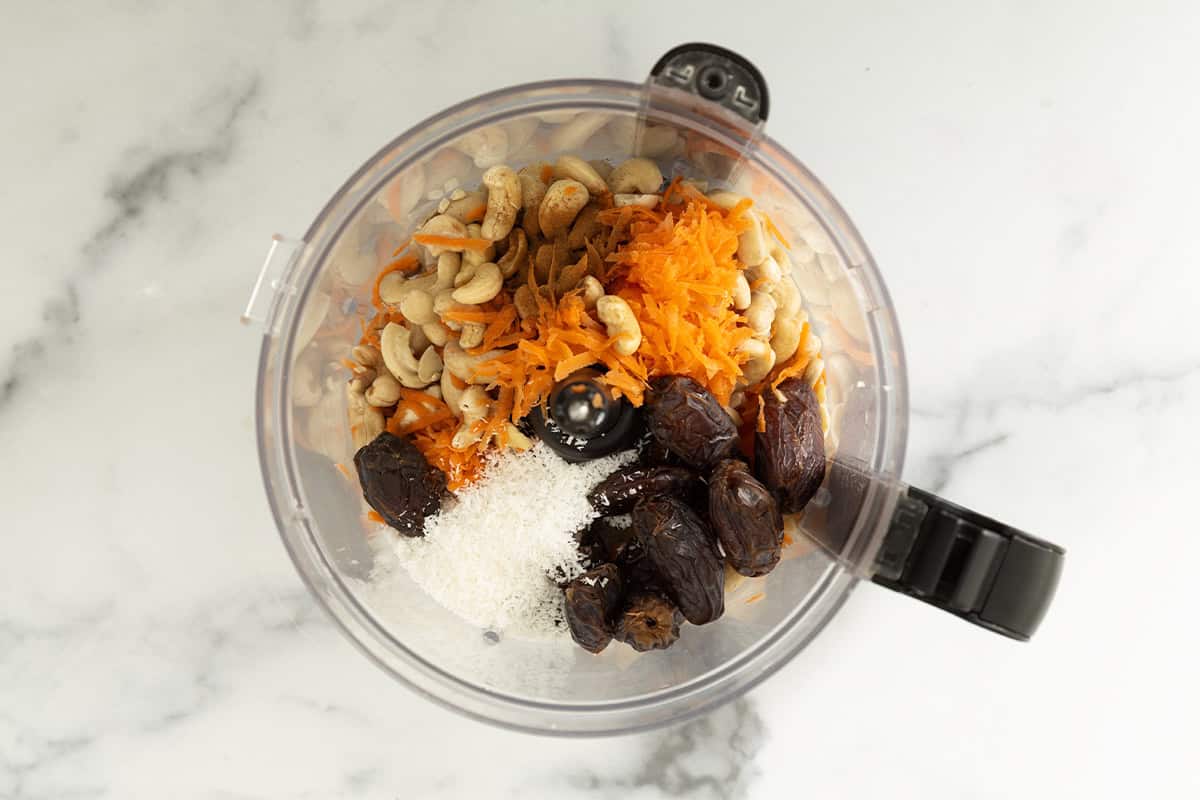 Ingredients for carrot balls in food processor.