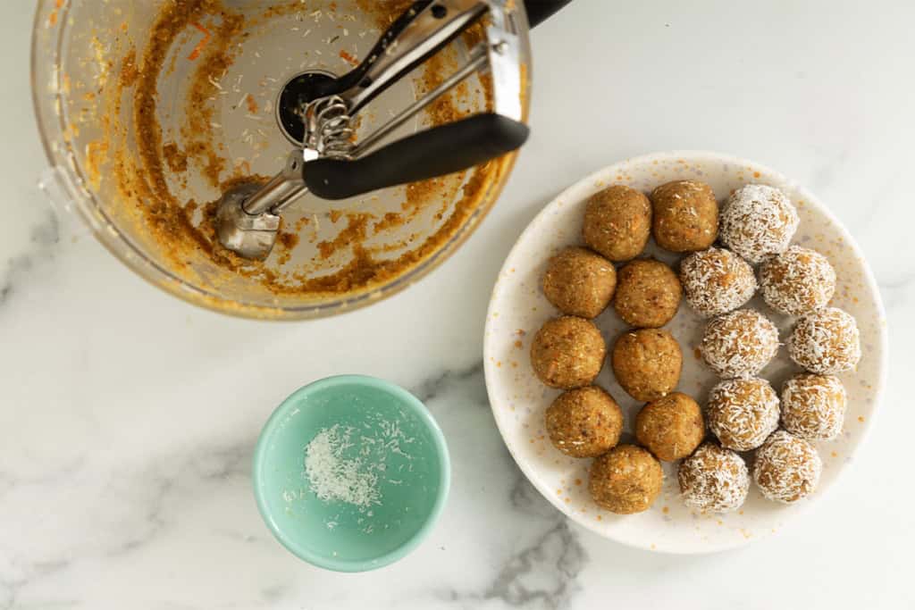 Making carrot balls with cookie scoop.