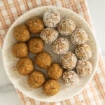 Carrot balls on white plate and towel.