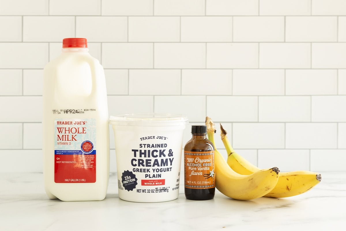 Ingredients for banana shake on countertop.