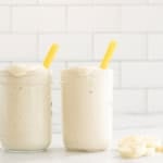Banana shake in two glasses with straws.