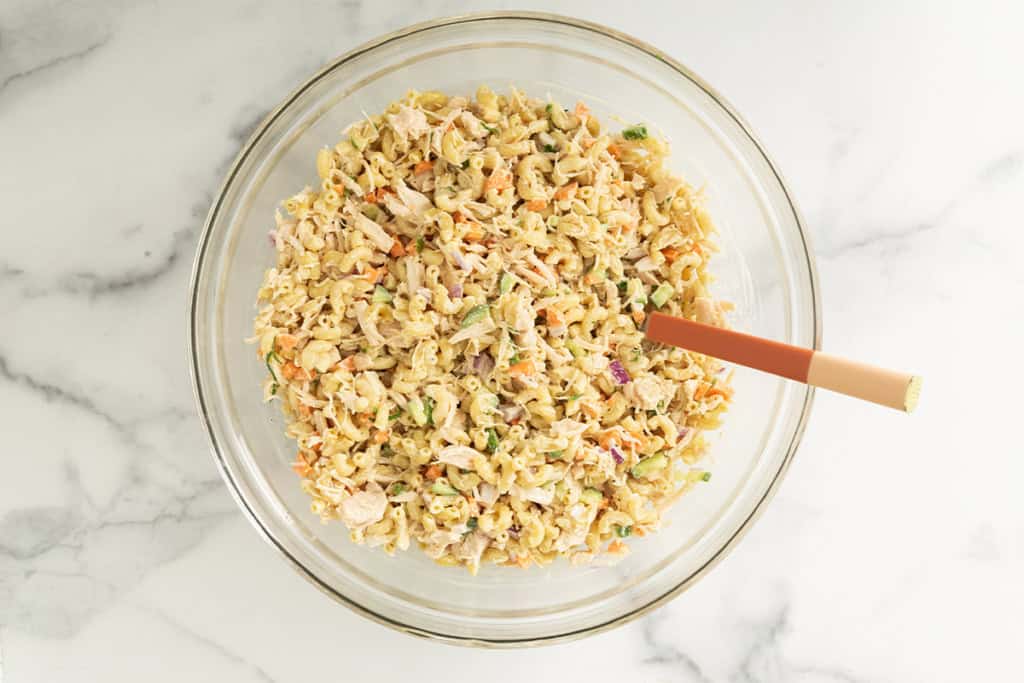 Chicken mac salad in glass bowl.