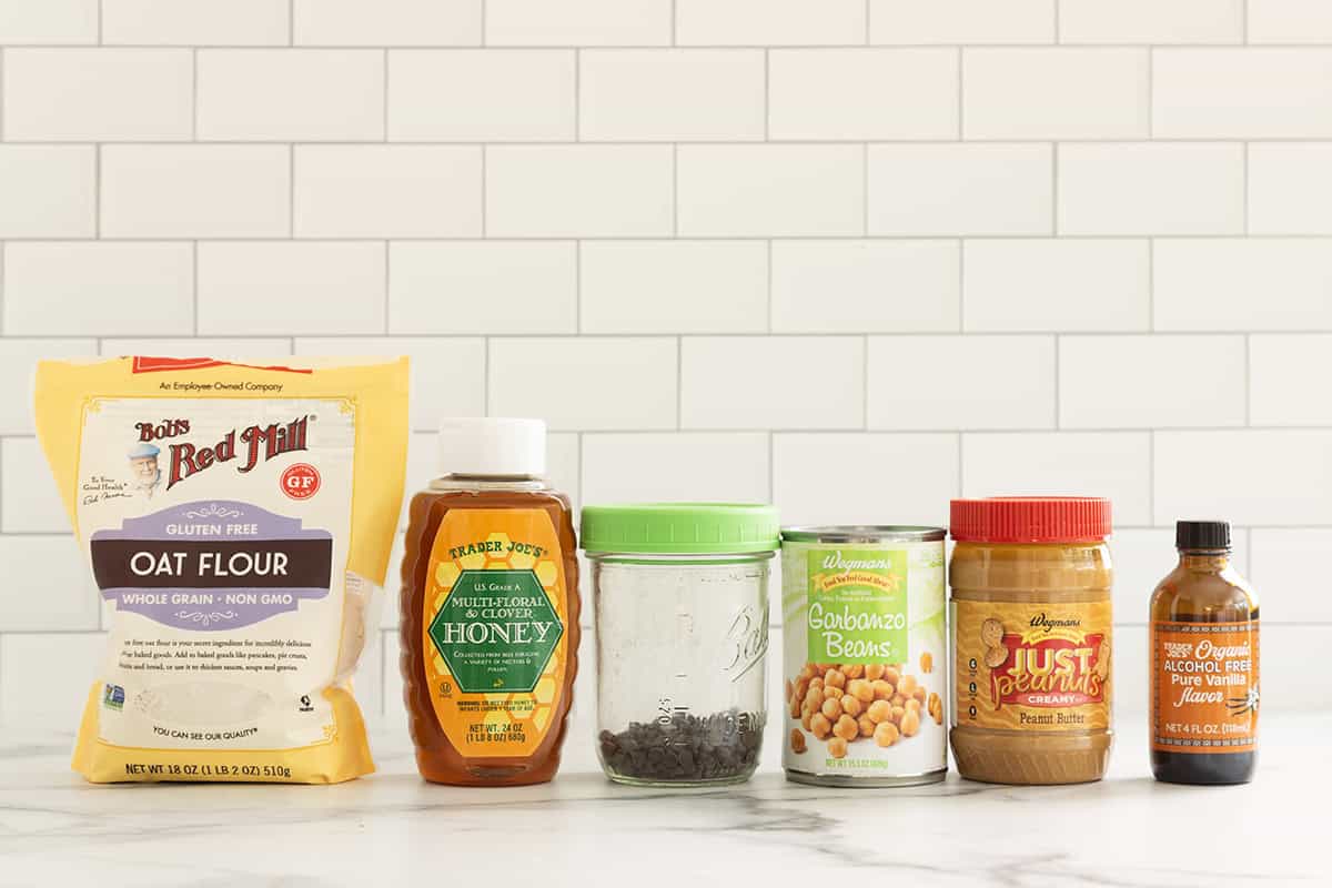 Ingredients for chickpea cookie dough on countertop.