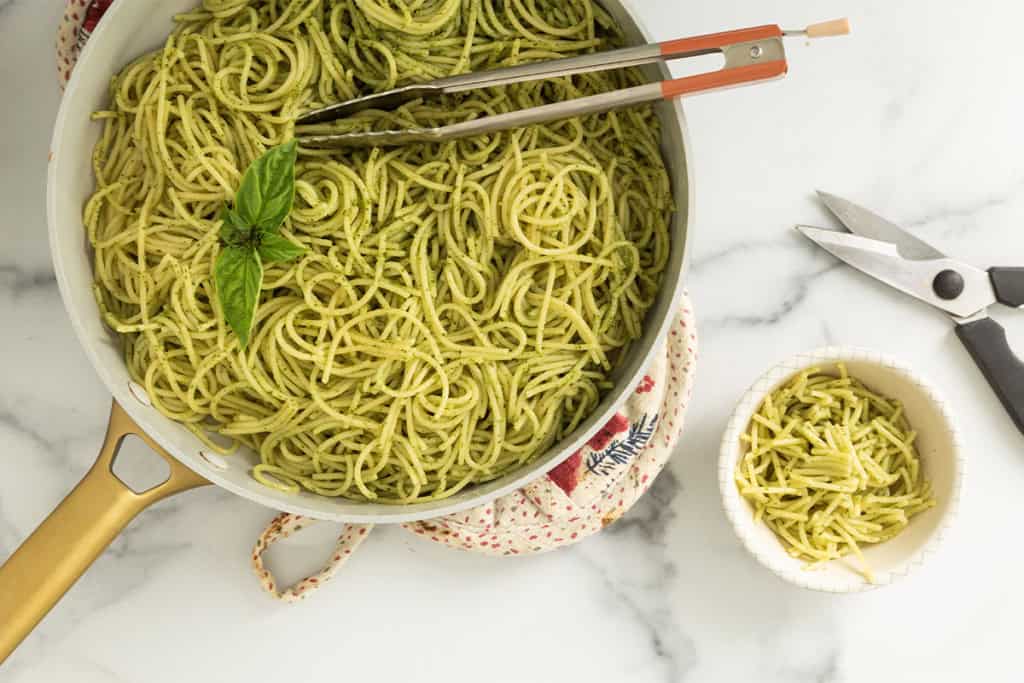 Pesto Spaghetti in small bowl and pot.