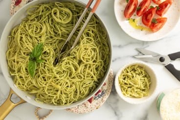 Pesto Spaghetti in small bowl and pot.