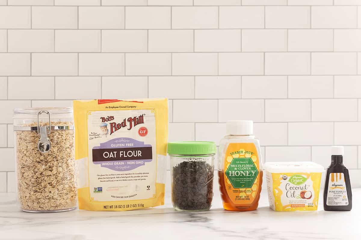 Ingredients for Chewy Chocolate Chip Granola Bars on countertop.