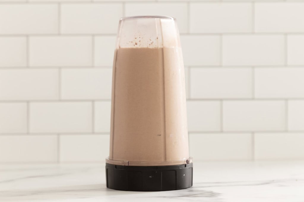 Chocolate peanut butter banana smoothie in blender.