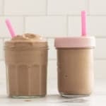 Chocolate peanut butter banana smoothie in two cups with straws.