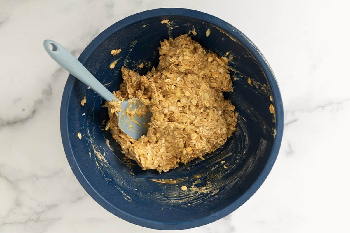 Batter for pb oatmeal bars in blue bowl.