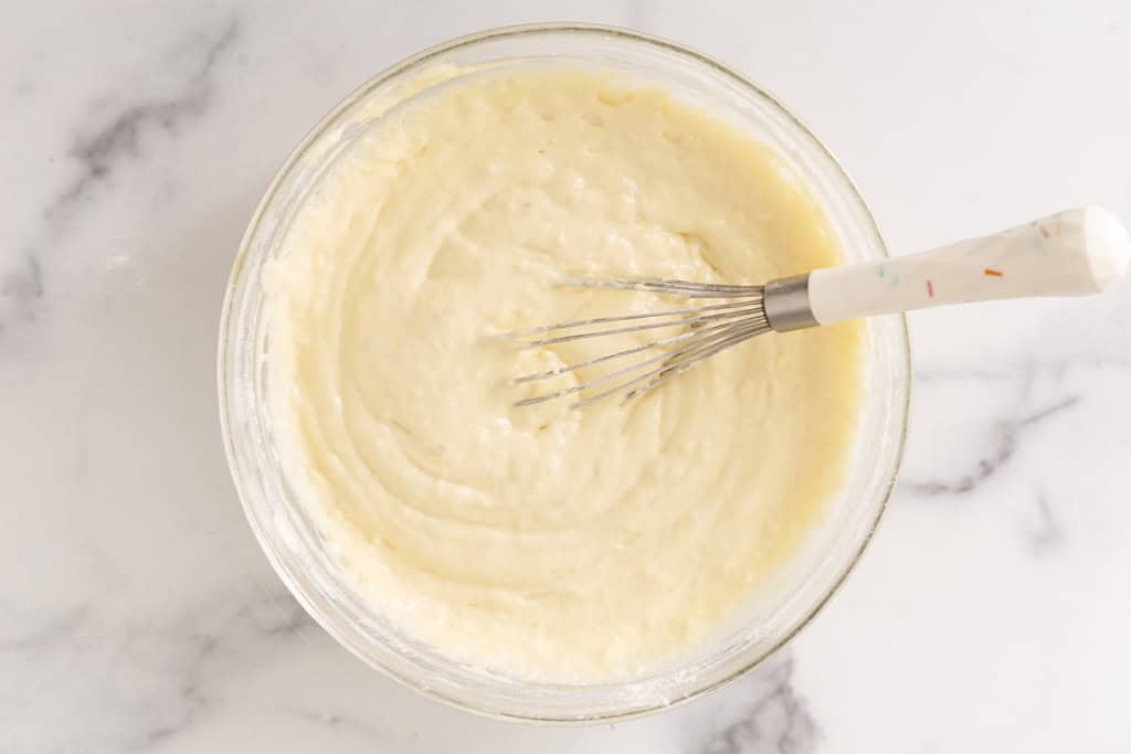 Batter for waffle sticks in glass bowl.