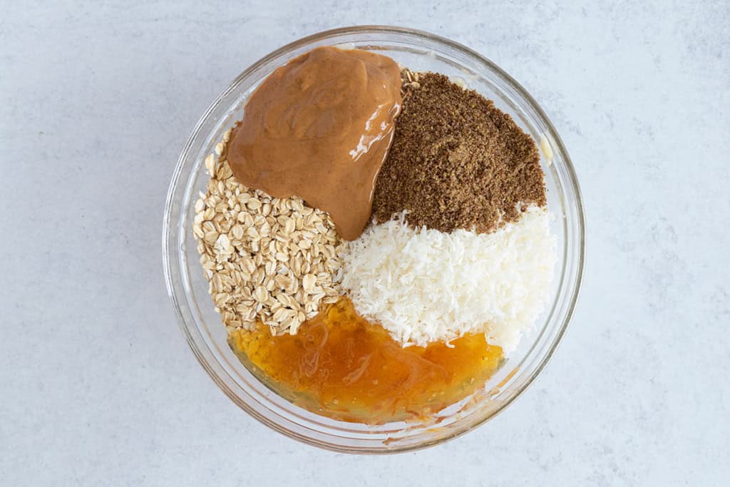 Ingredients in glass bowl before mixing for breakfast cookies.