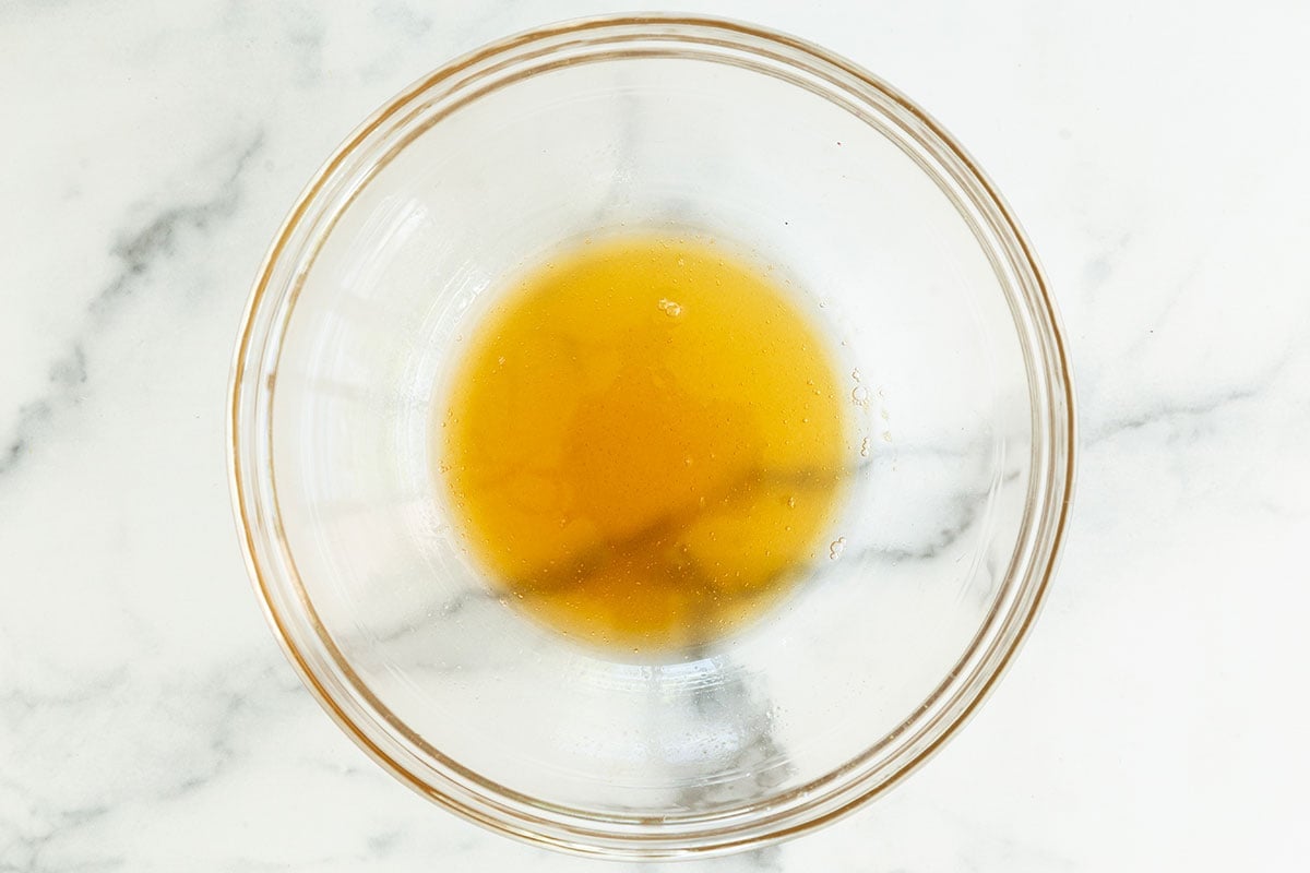 Honey in glass bowl for Chewy Chocolate Chip Granola Bars.
