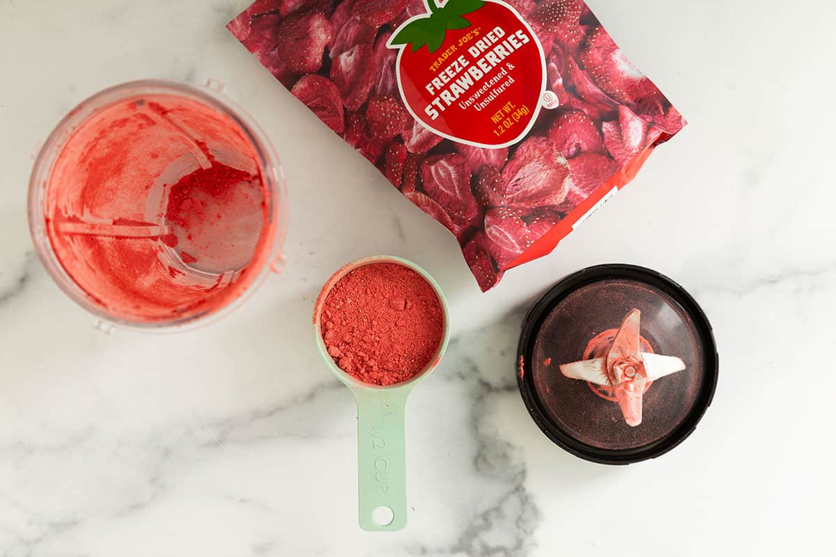 Blending freeze dried strawberries for strawberry cheesecake ice cream.