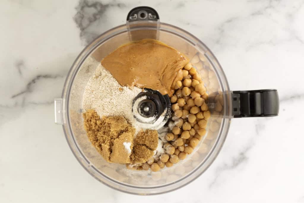 Ingredients for chickpea cookies in food processor before blending.