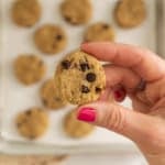 Hands holding one chickpea cookie.