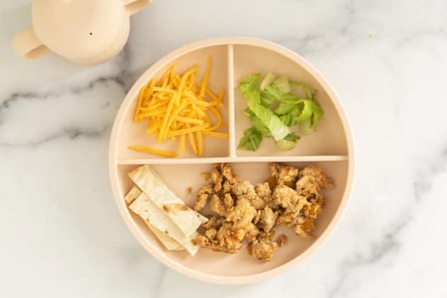 kids plate of ground chicken tacos deconstructed.