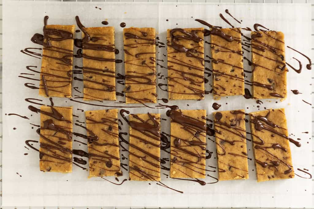 Healthy snack bars drizzled in chocolate.