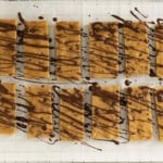 Healthy snack bars drizzled in chocolate.