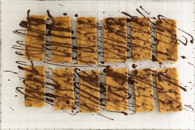 Healthy snack bars drizzled in chocolate.