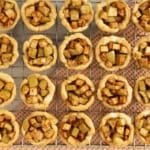 Mini apple pies on cooling rack.