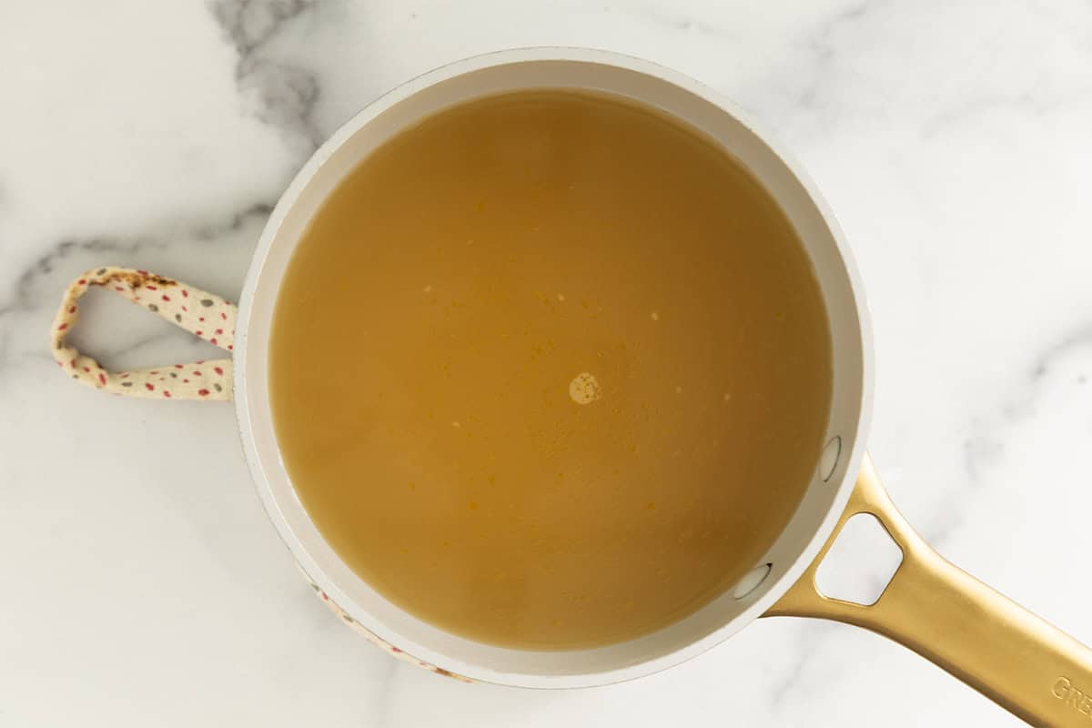 Broth in pot for pastina with egg.