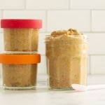 Pumpkin chia seed pudding on countertop in three glasses.