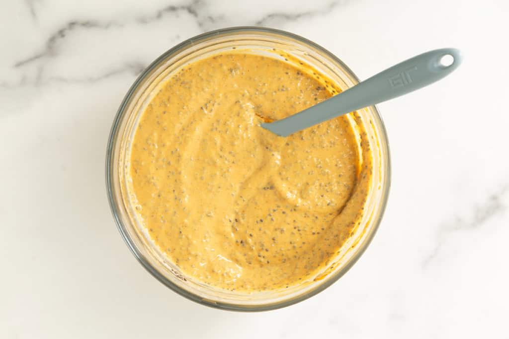 pumpkin chia seed pudding mix in glass bowl.