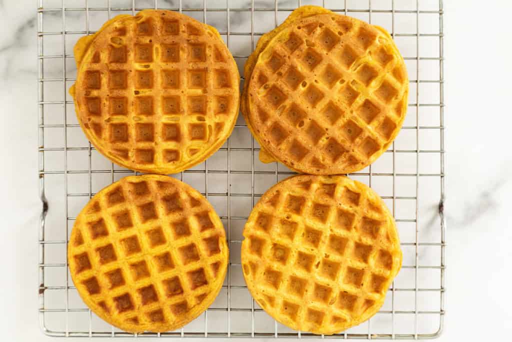 Pumpkin waffles on cooling rack.