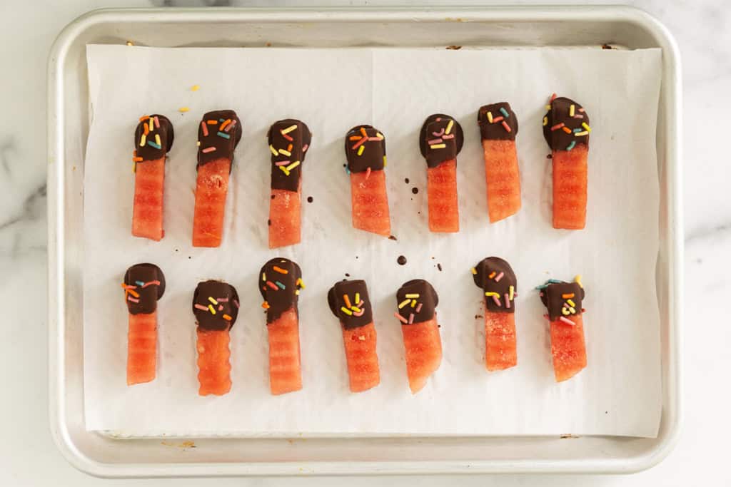 Watermelon fries dipped in chocolate.