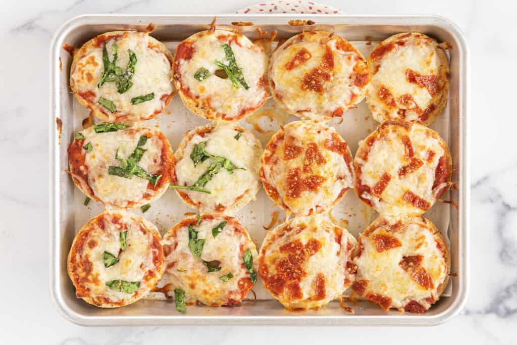 bagel pizza bites on baking pan.