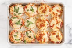 bagel pizza bites on baking pan.