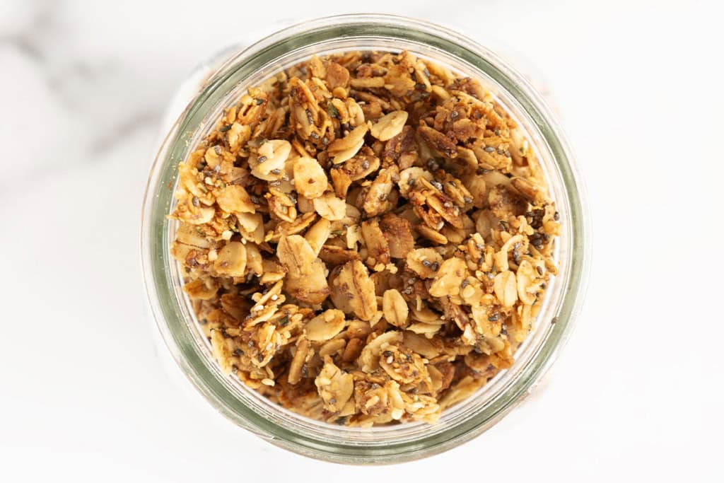 Lower sugar granola in glass jar.